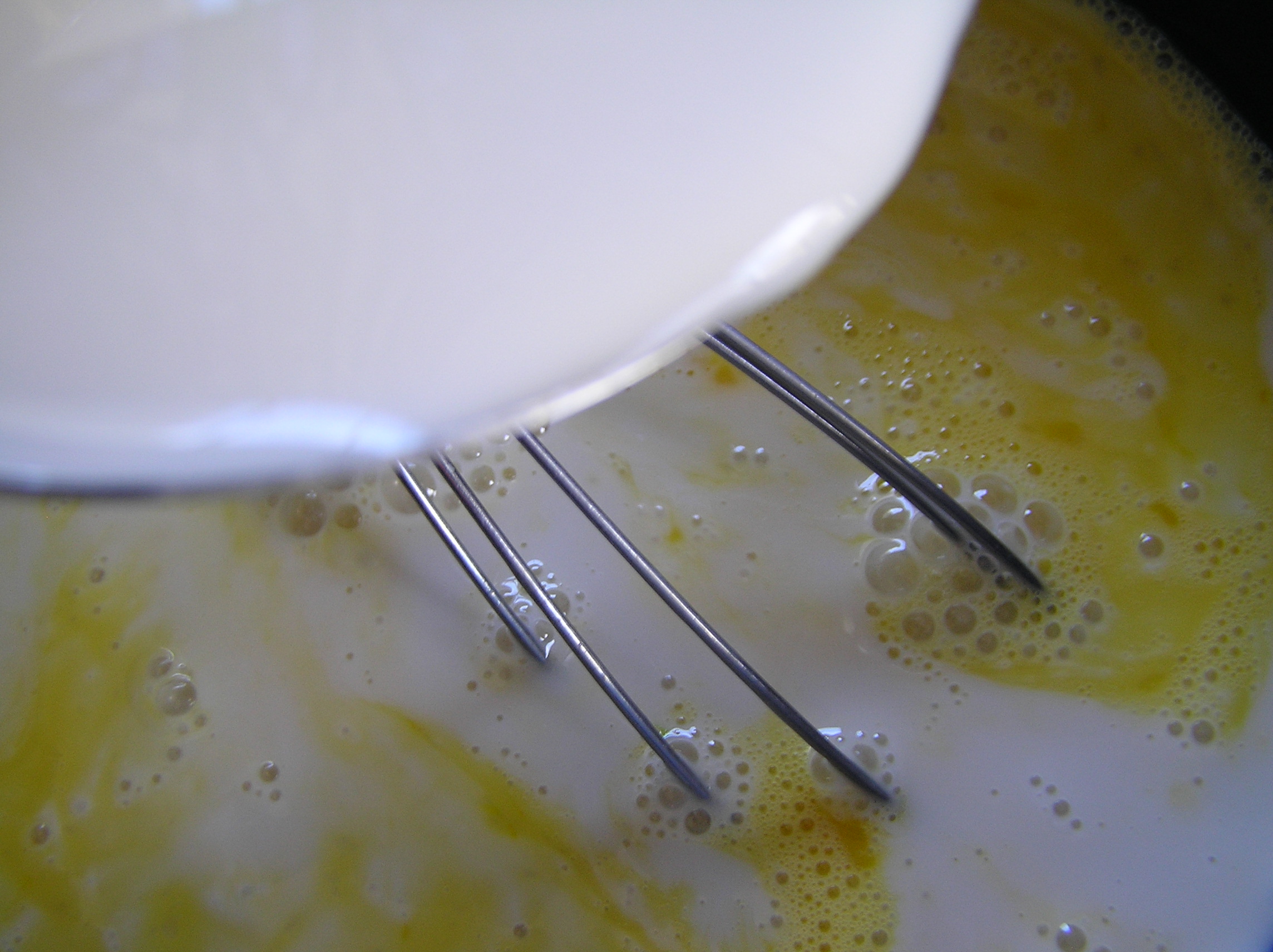 Whisk milk into the eggs Zen of Slow Cooking Blog